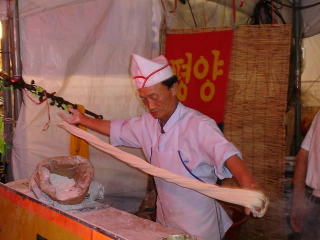 nooodles,... this guy stretched them right before my eyes, and i ate them deliciously.